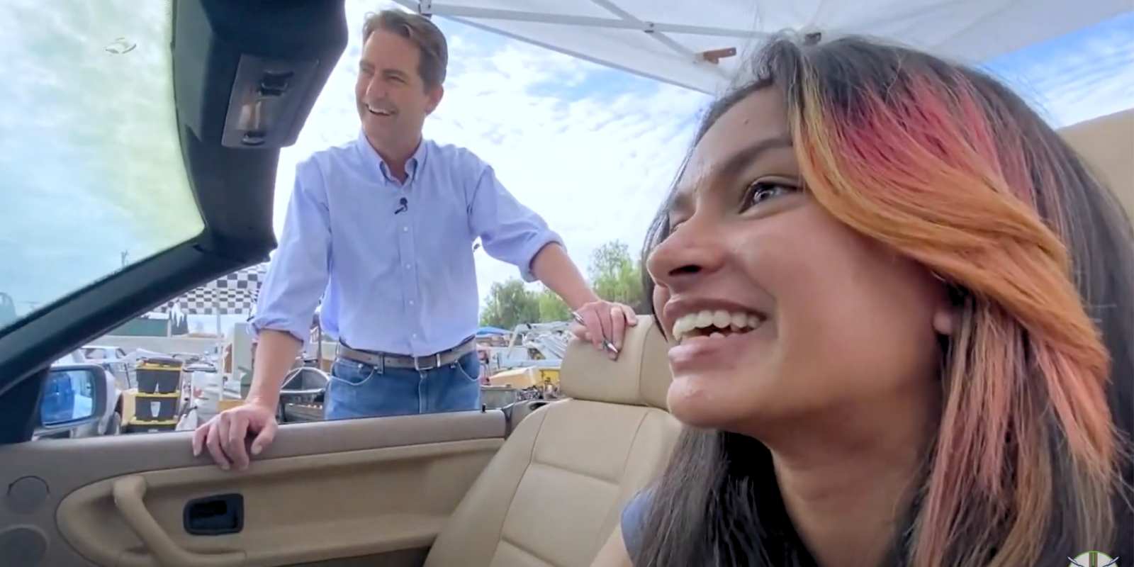 Sonia driving BMW driving sim interview on CBS